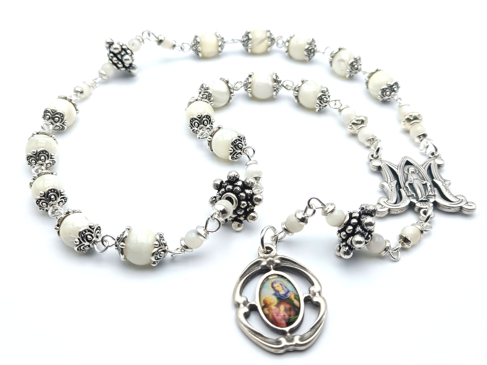 Saint Ann unique rosary beads prayer chaplet, with mother of pearl beads, silver picture medal, bead caps and miraculous medal centre.