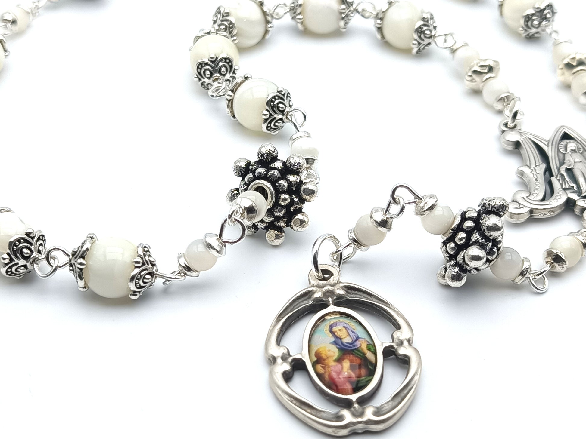 Saint Ann unique rosary beads prayer chaplet, with mother of pearl beads, silver picture medal, bead caps and miraculous medal centre.