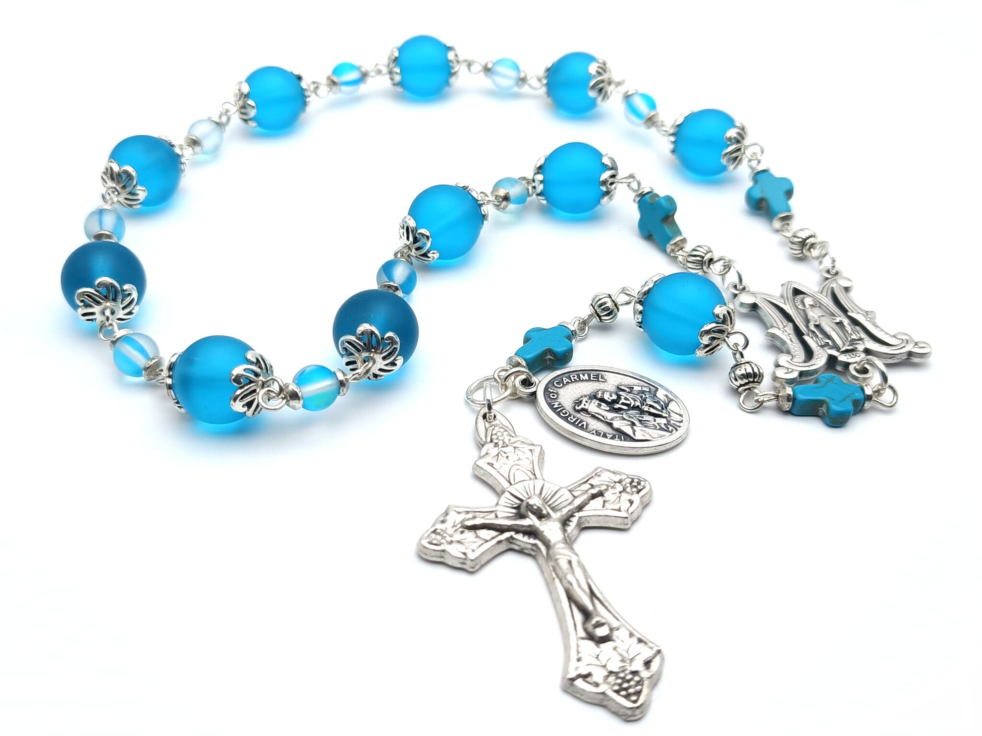 Our Lady of Mount Carmel unique rosary beads single decade with blue glass beads, silver miraculous medal centre medal, vine leaves crucifix and Our Lady of Mount Carmel medal.