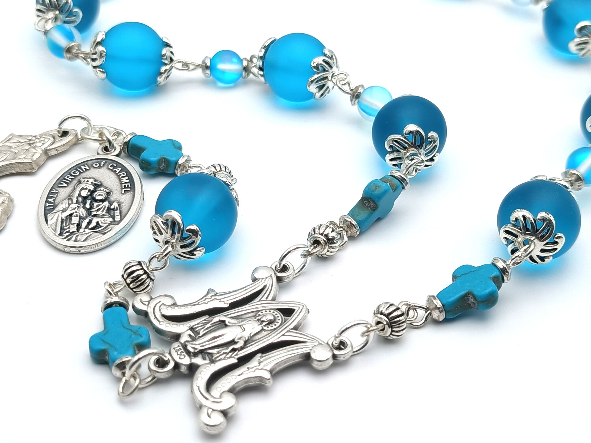 Our Lady of Mount Carmel unique rosary beads single decade with blue glass beads, silver miraculous medal centre medal, vine leaves crucifix and Our Lady of Mount Carmel medal.