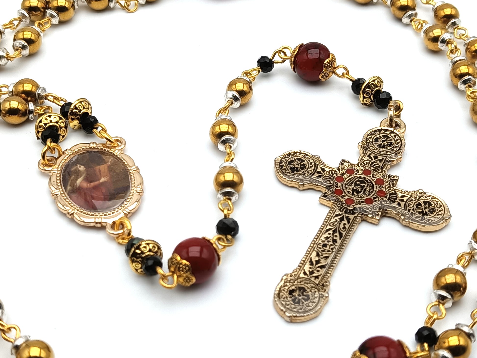 Saint Mary Magdalene unique rosary beads with gold hematite beads, red jasper pater beads, golden picture centre medal and decorative crucifix.