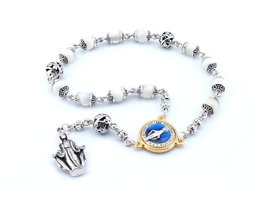 Immaculate Conception unique rosary beads single decade rosary in 925 solid sterling silver with golden Immaculate Conception centre medal and solid silver statue end medal.