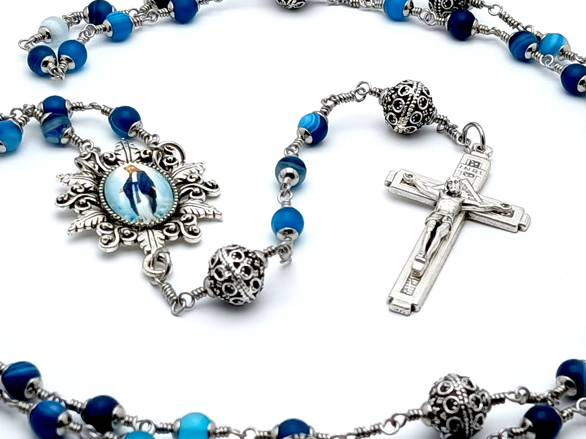 Our Lady of Grace unbeakable unique rosary beads with blue frosted agate gemstone beads and silver pater beads, picture centre medal and crucifix.