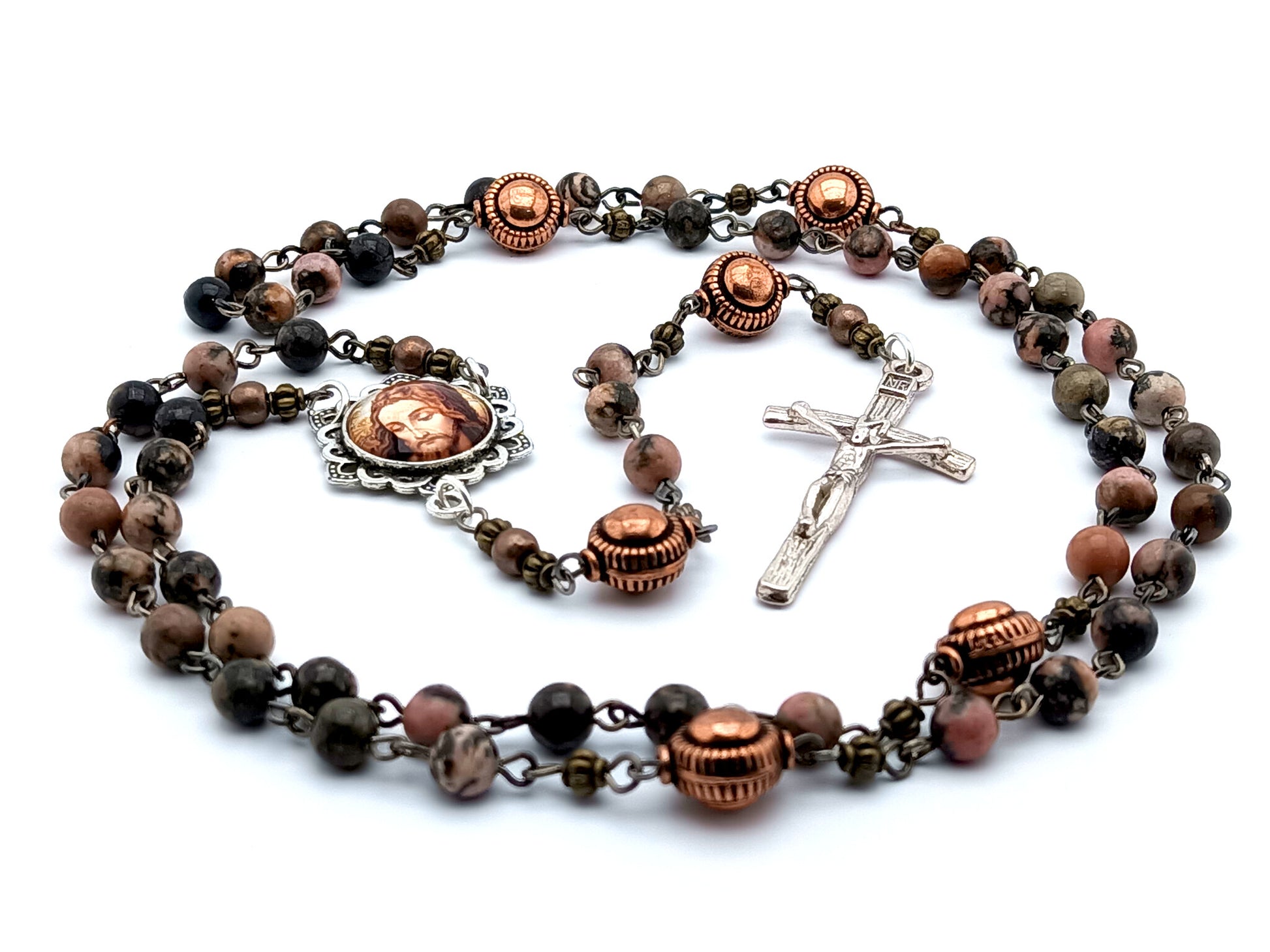 The Holy Face of Jesus unique rosary beads with rhodochrosite gemstone beads, copper pater beads, silver crucifix and picture centre medal.