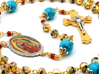 Our Lady of Guadalupe rosary beads in gold cloisonne and turquoise with golden Saint Benedict crucifix.