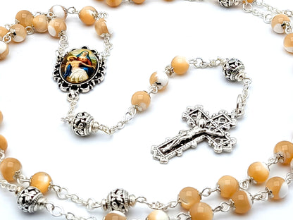 La Pieta unique rosary beads with mother of pearl and silver beads, silver crucifix and picture centre medal.