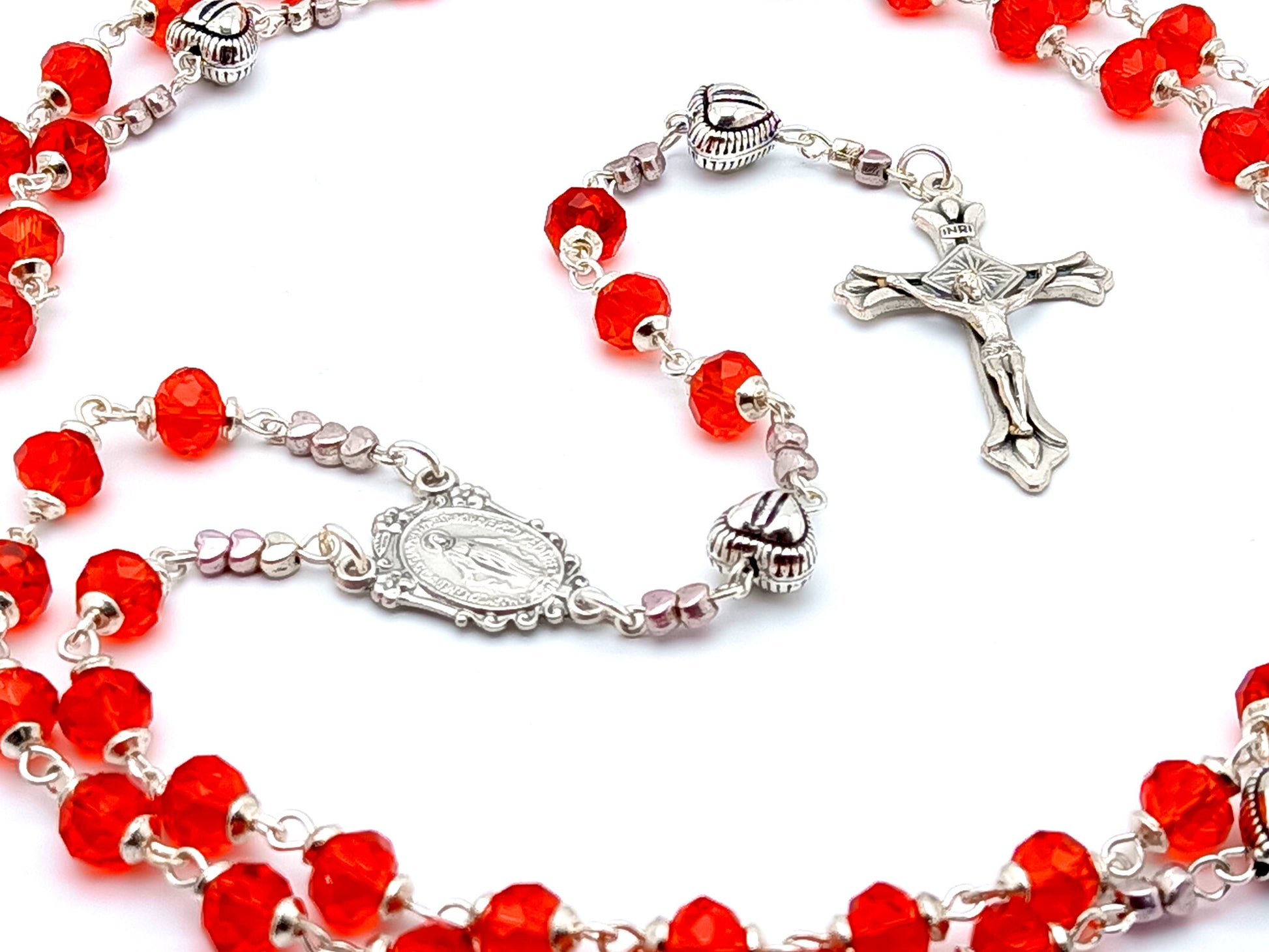 Miraculous medal unique rosary beads with red faceted glass and silver beads, silver crucifix and centre medal.
