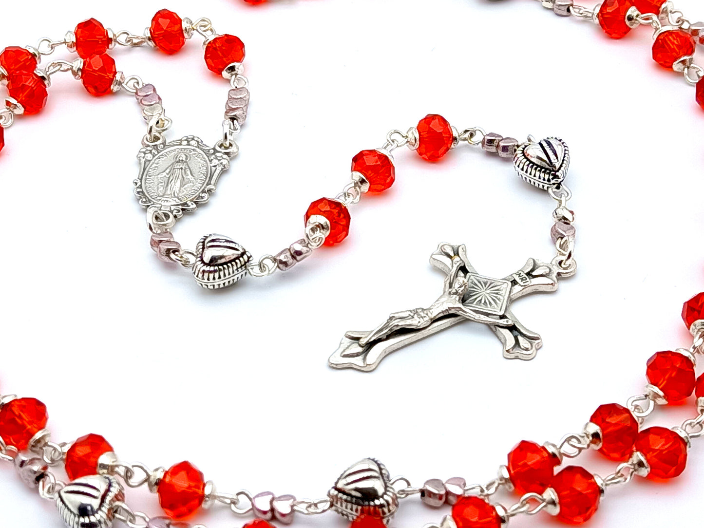 Miraculous medal unique rosary beads with red faceted glass and silver beads, silver crucifix and centre medal.