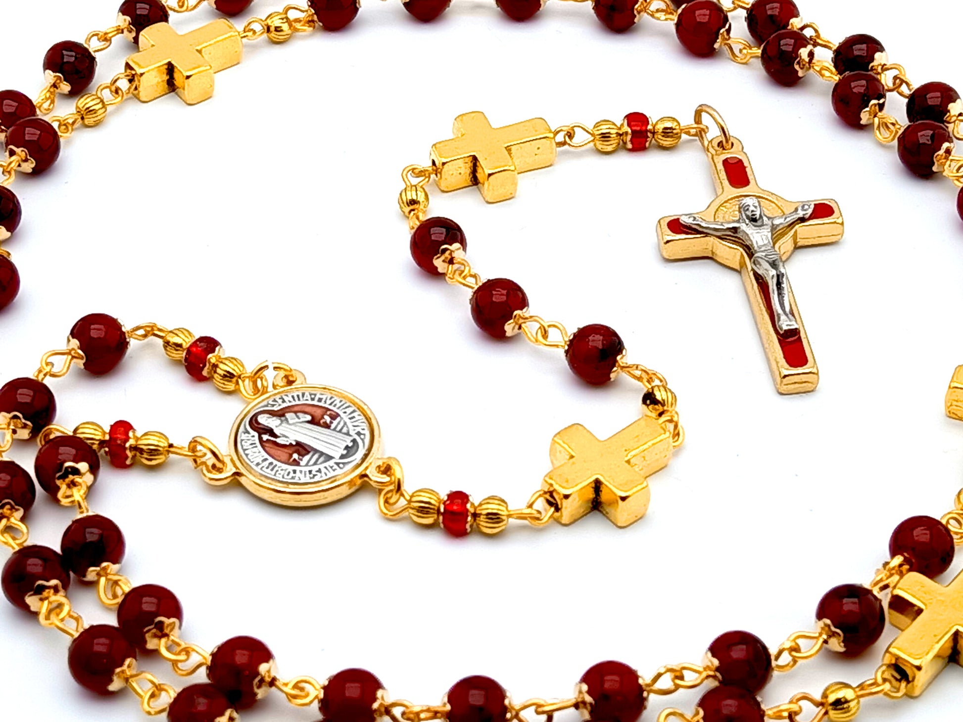 Saint Benedict unique rosary beads with deep red glass and golden cross beads, red and gold enamel crucifix and centre medal.