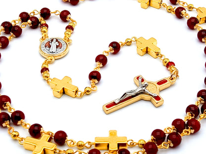 Saint Benedict unique rosary beads with deep red glass and golden cross beads, red and gold enamel crucifix and centre medal.