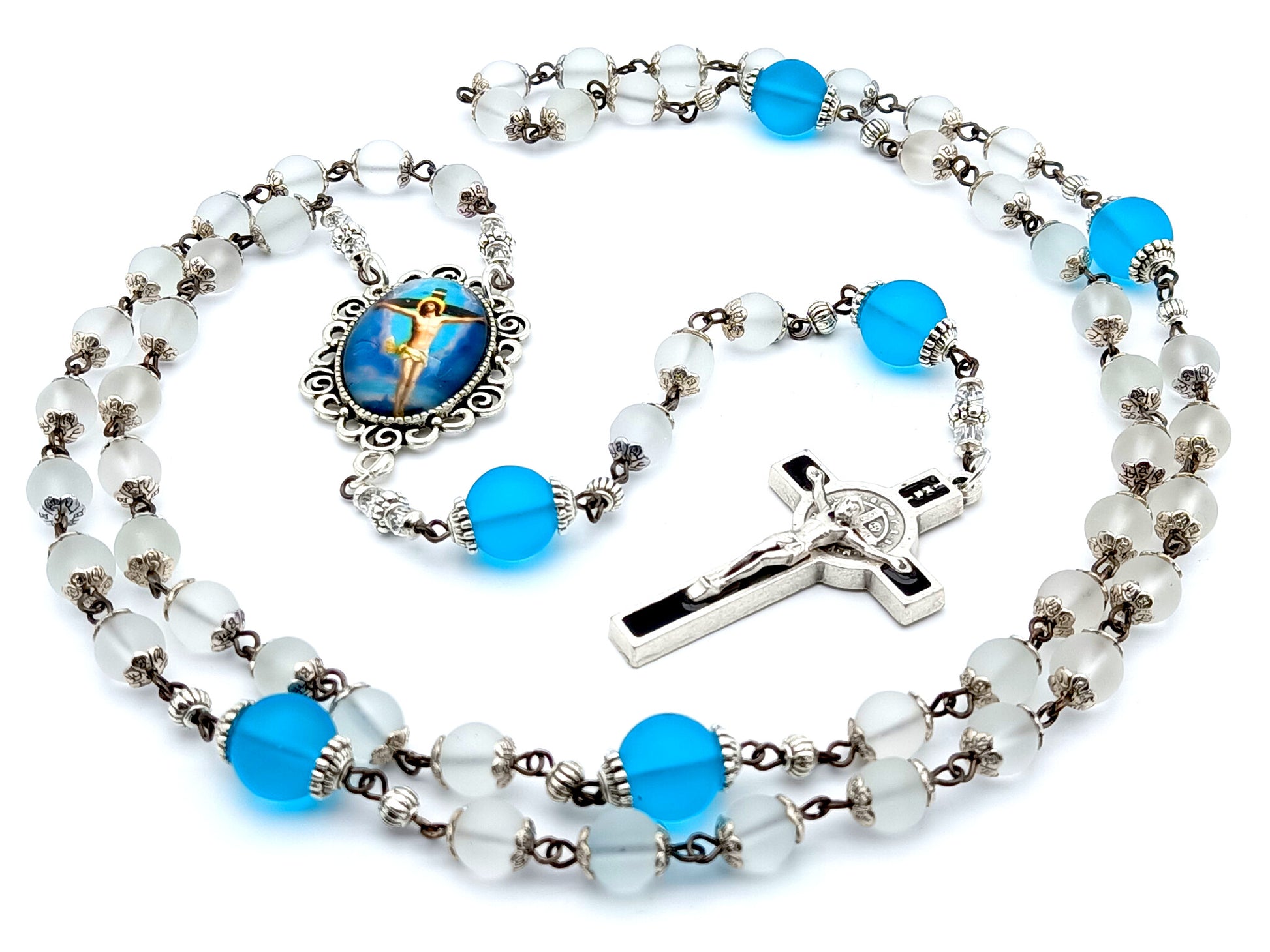 The Crucifixion unique rosary beads with frosted clear and blue glass beads, black and silver enamel crucifix and picture centre medal.