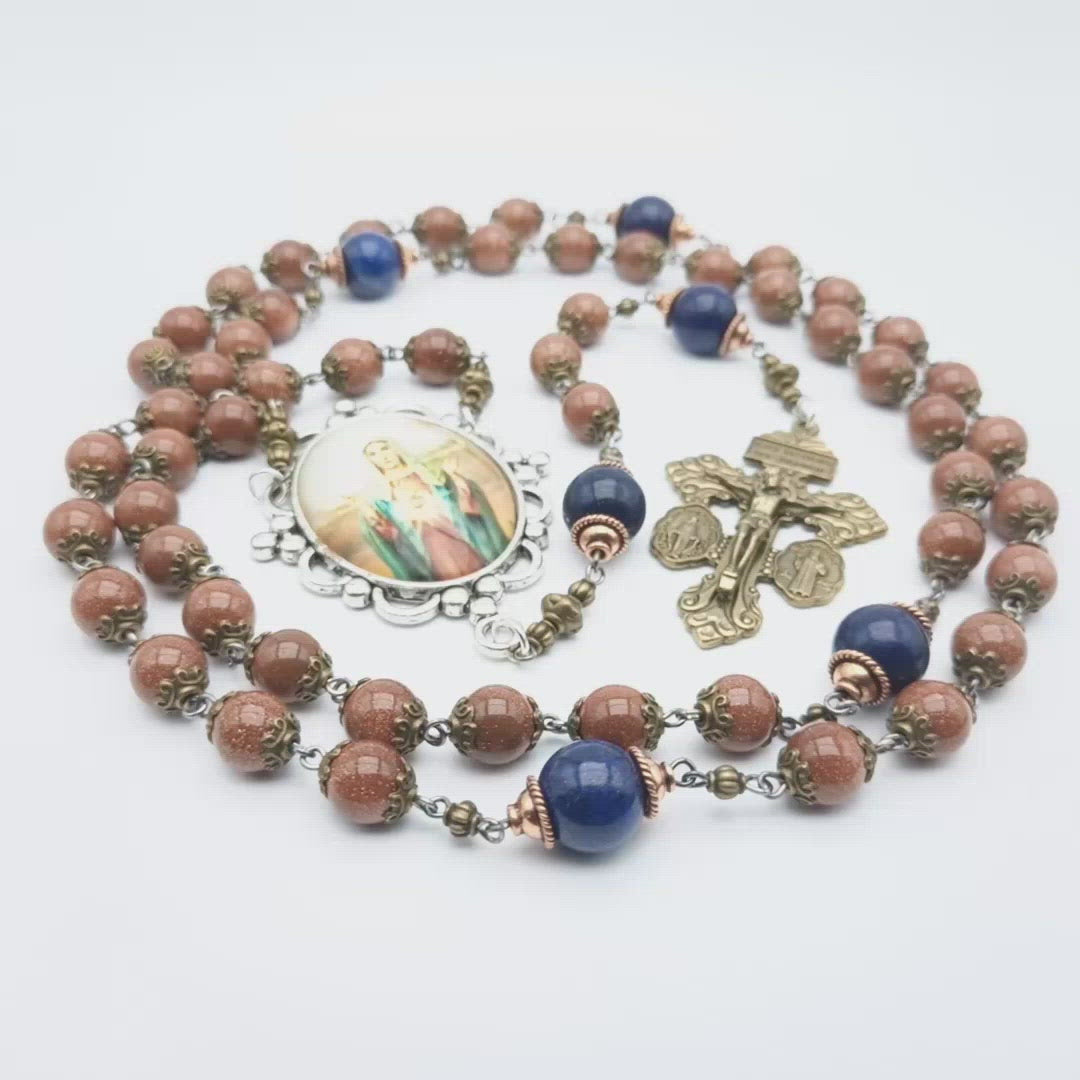 Immaculate Heart unique rosary beads with sparkling rust gemstone beads, blue pater beads, bronze pardon crucifix and silver Our Lady picture centre medal.