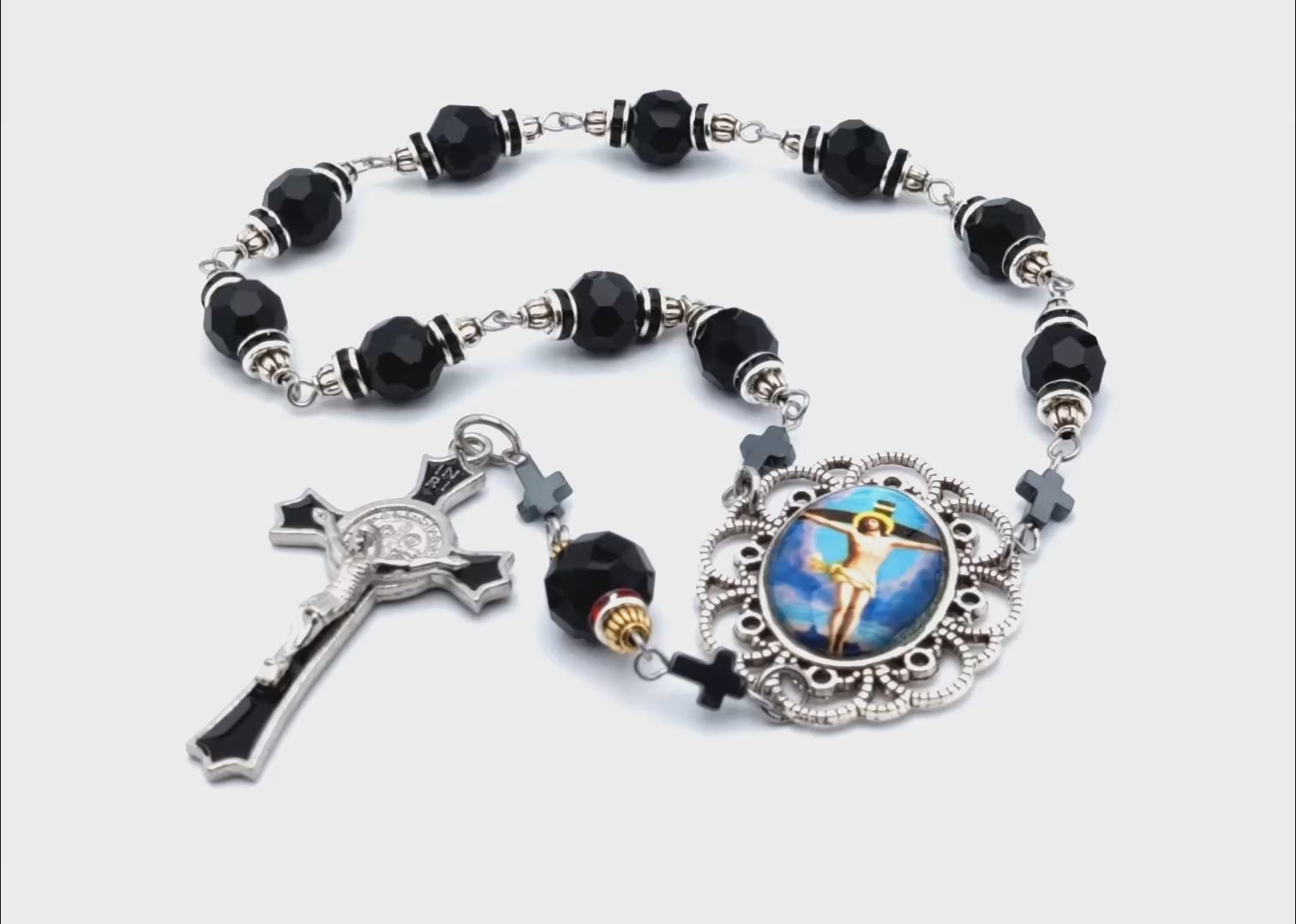 The Crucifixion unique rosary beads single decade rosary with black faceted glass beads, black enamel crucifix and silver picture centre medal.