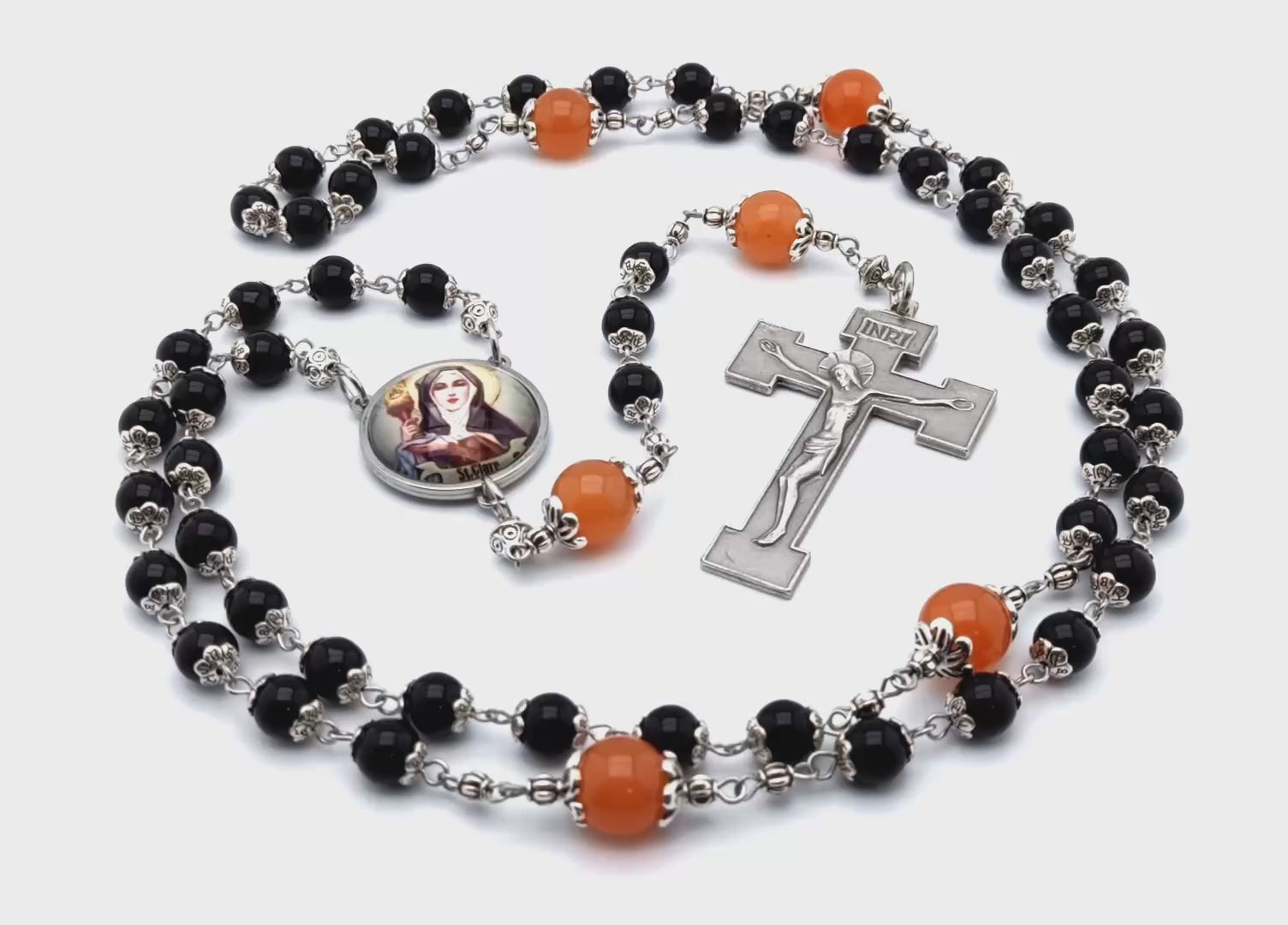 Saint Clare unique rosary beads with black onyx and tangerine gemstone beads, silver crucifix and picture centre medal.