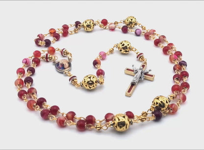 Saint Mary Magdalen unique rosary beads with striped red agate and gold beads, Resurrection crucifix. and small picture medal.