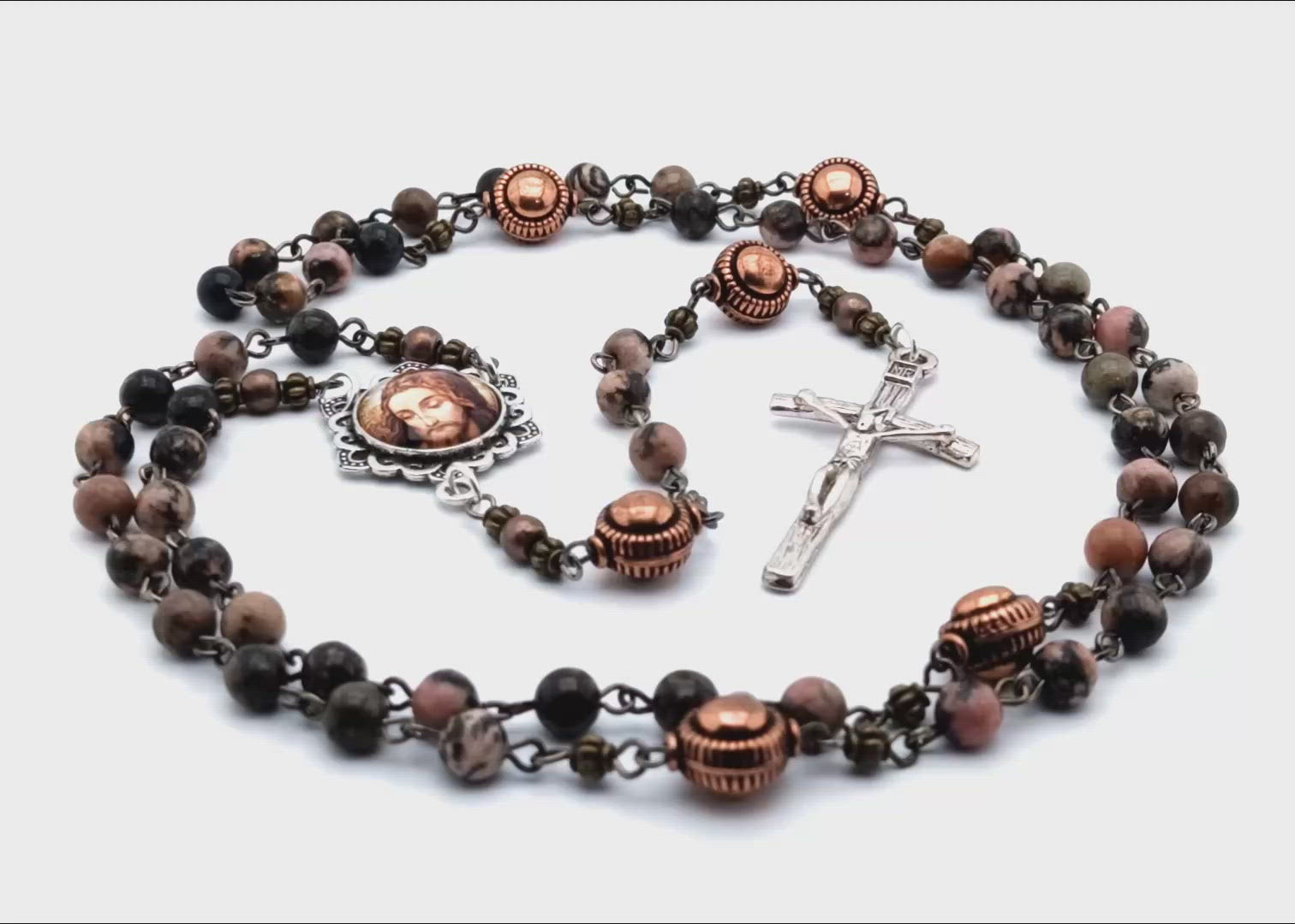 The Holy Face of Jesus unique rosary beads with rhodochrosite gemstone beads, copper pater beads, silver crucifix and picture centre medal.