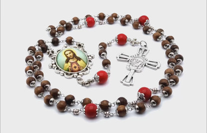 Sacred Heart unique rosary beads with dark wood and red gemstone beads, silver Holy Face crucifix and picture centre medal.