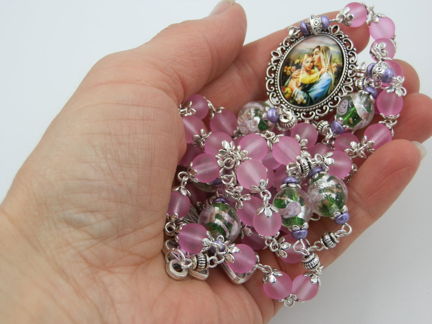 Virgin Mary unique rosary beads with pink and floral glass beads, silver harlequin crucifix and picture centre medal.