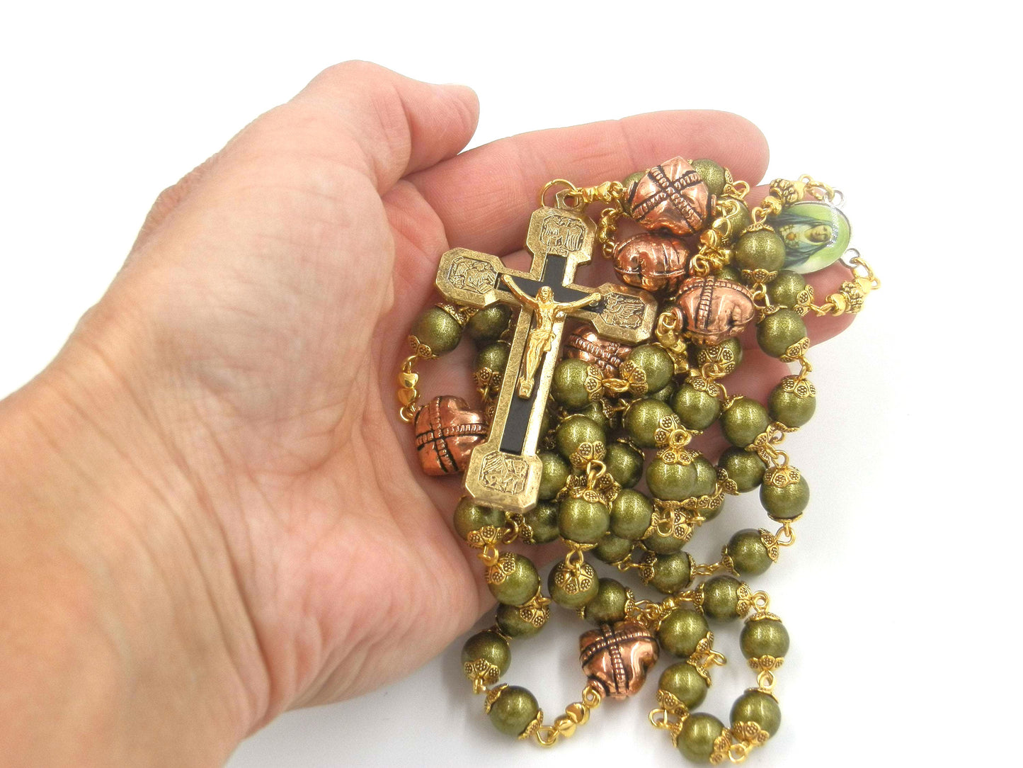 Green glass rosary with copper, gold and black crucifix and Our Lady of Sorrows medal.