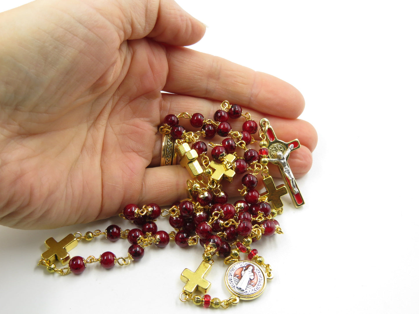 Saint Benedict unique rosary beads with deep red glass and golden cross beads, red and gold enamel crucifix and centre medal.