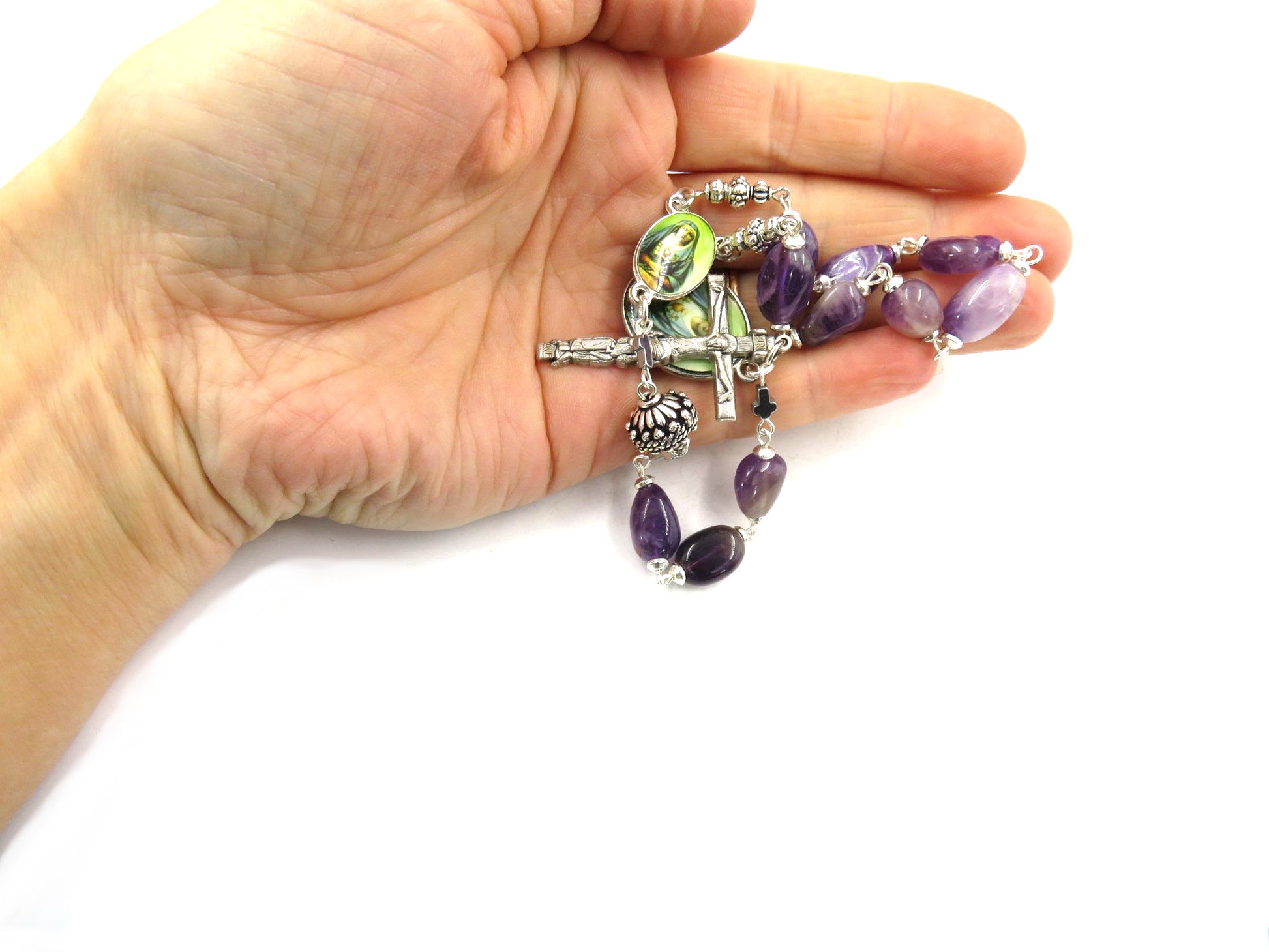 Pocket servite unique dolor rosary with purple gemstone beads and silver crucifix and Our Lady of Sorrows medals.