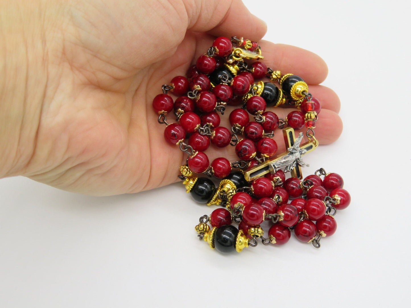 The Resurrection unique rosary beads with deep red and black glass beads, gold and black enamel crucifix and centre medal.