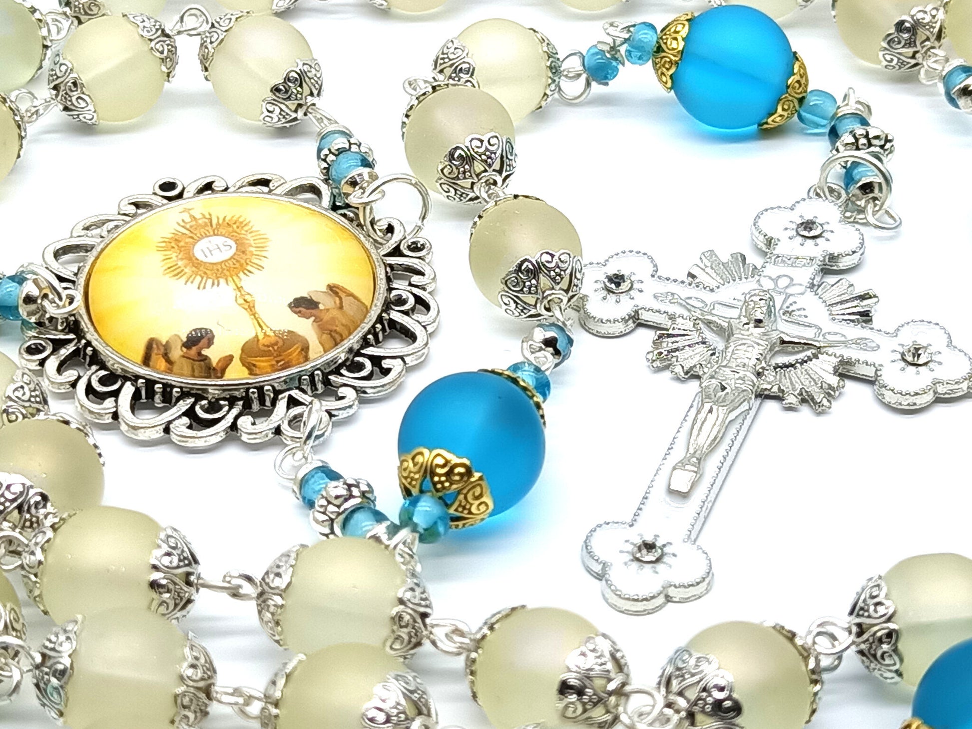 Confirmation unique rosary beads with frosted off white and blue glass beads, silver and white enamel crucifix and picture centre medal.