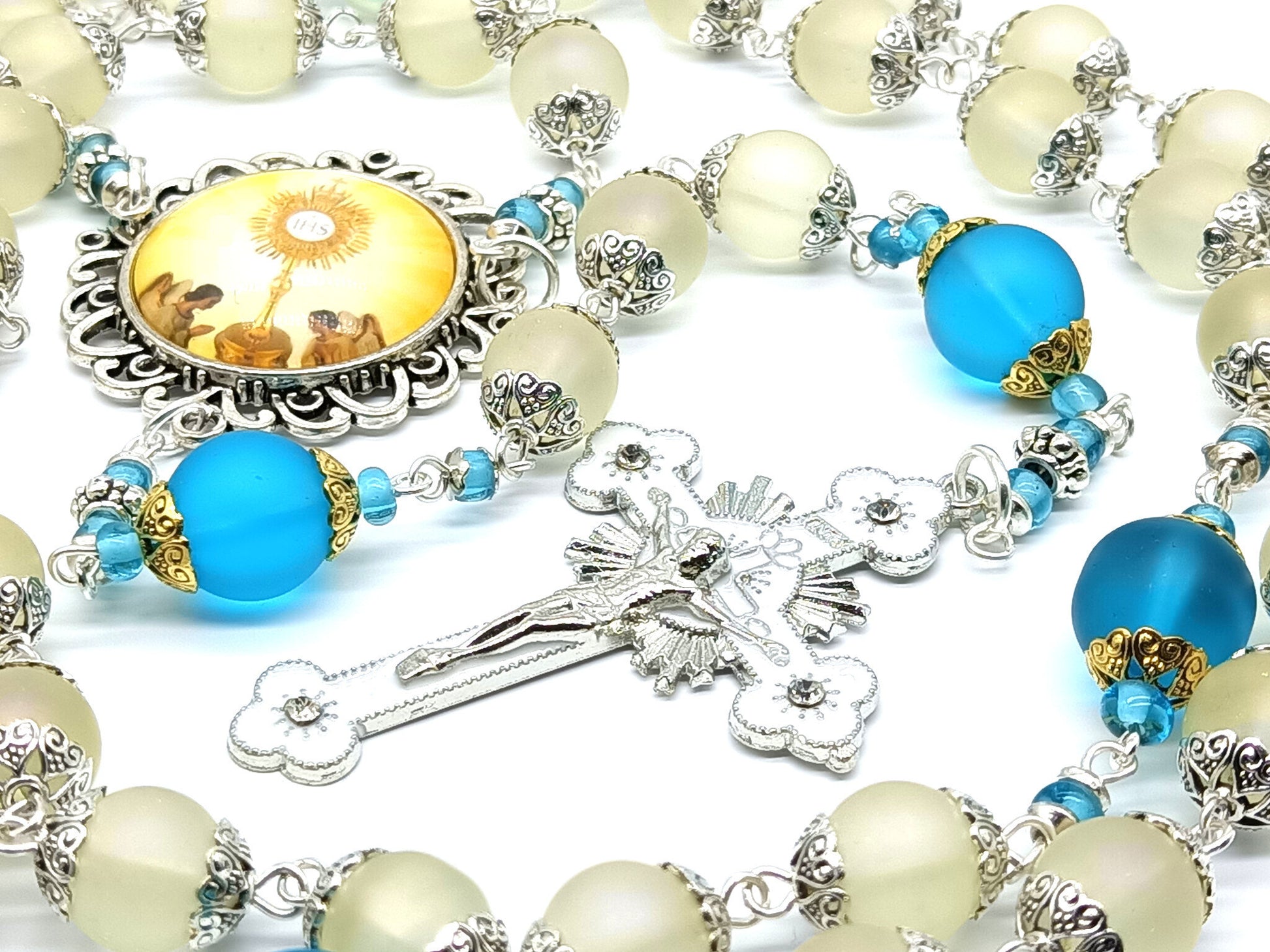 Confirmation unique rosary beads with frosted off white and blue glass beads, silver and white enamel crucifix and picture centre medal.