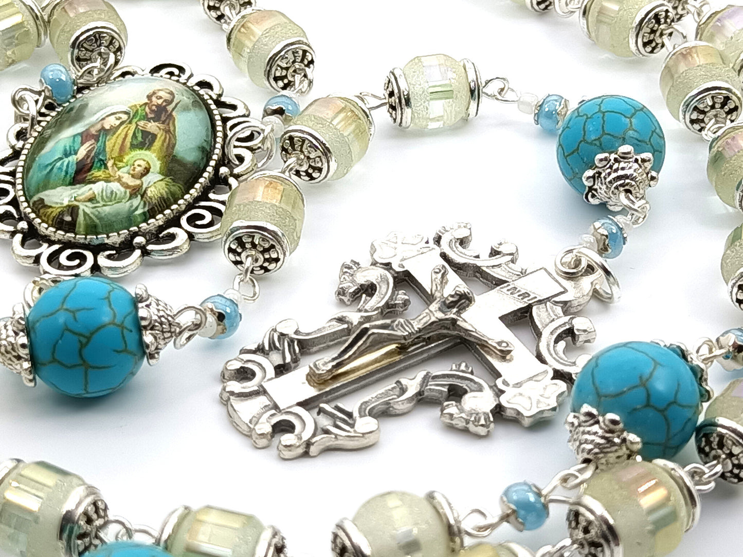 Holy Family unique rosary beads with frosted glass beads, blue gemstone pater beads, silver crucifix and picture centre medal. 