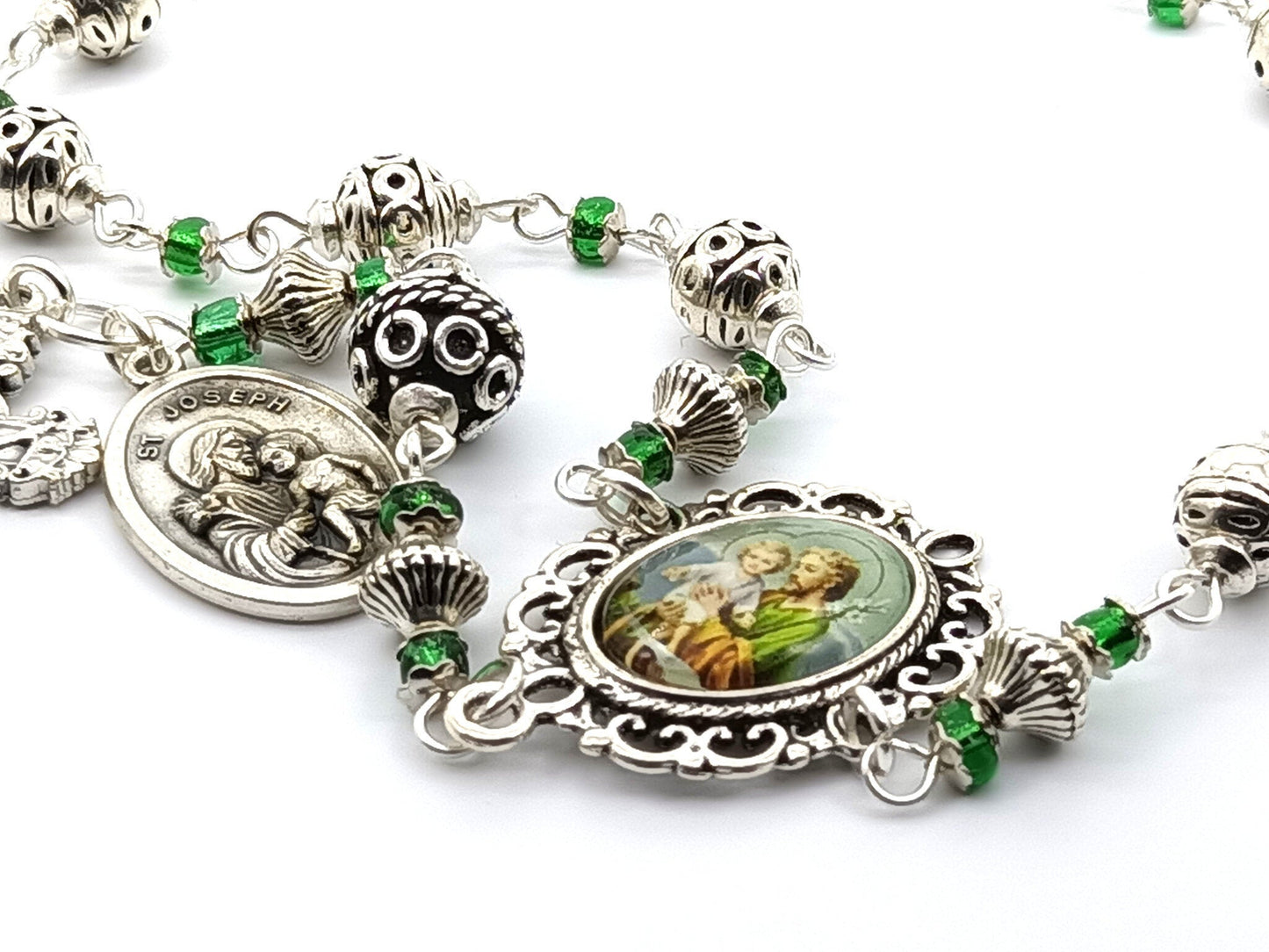 Saint Joseph unique rosary beads single decade with silver and green glass beads, silver crucifix and St. Joseph picture centre medal.