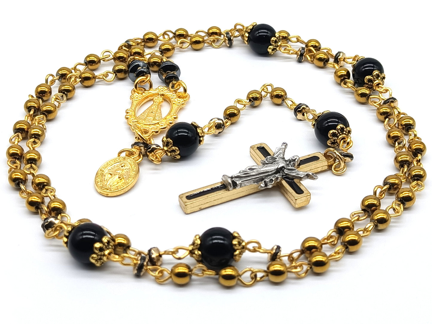 Our lady of Loretto unique rosary beads with gold hematite and onyx gemstone beads, gold and black enamel crucifix, medals and bead caps.