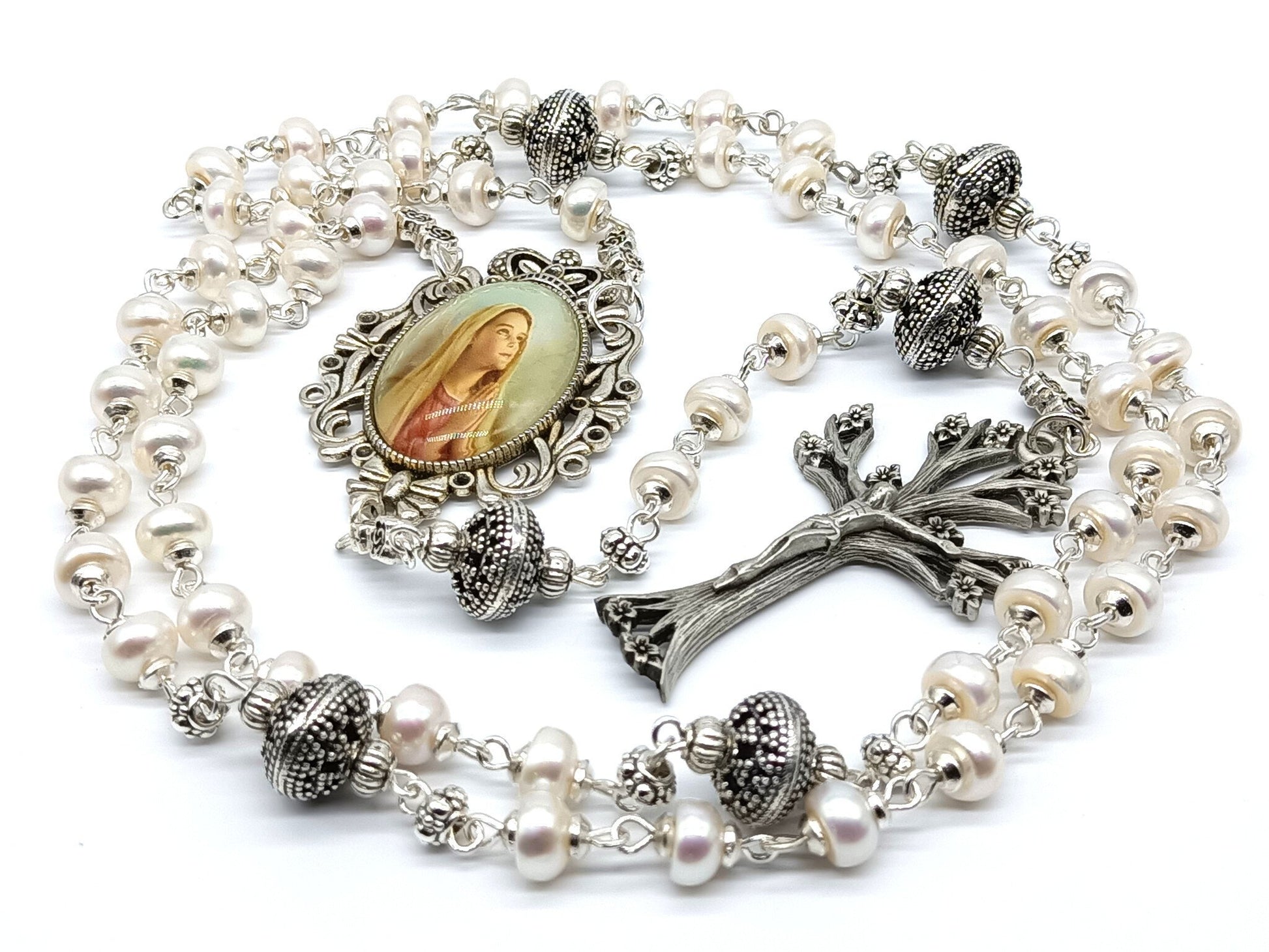 Genuine pearl unique rosary beads with dog wood crucifix, silver Our Ladys fiat picture medal and silver pater beads.