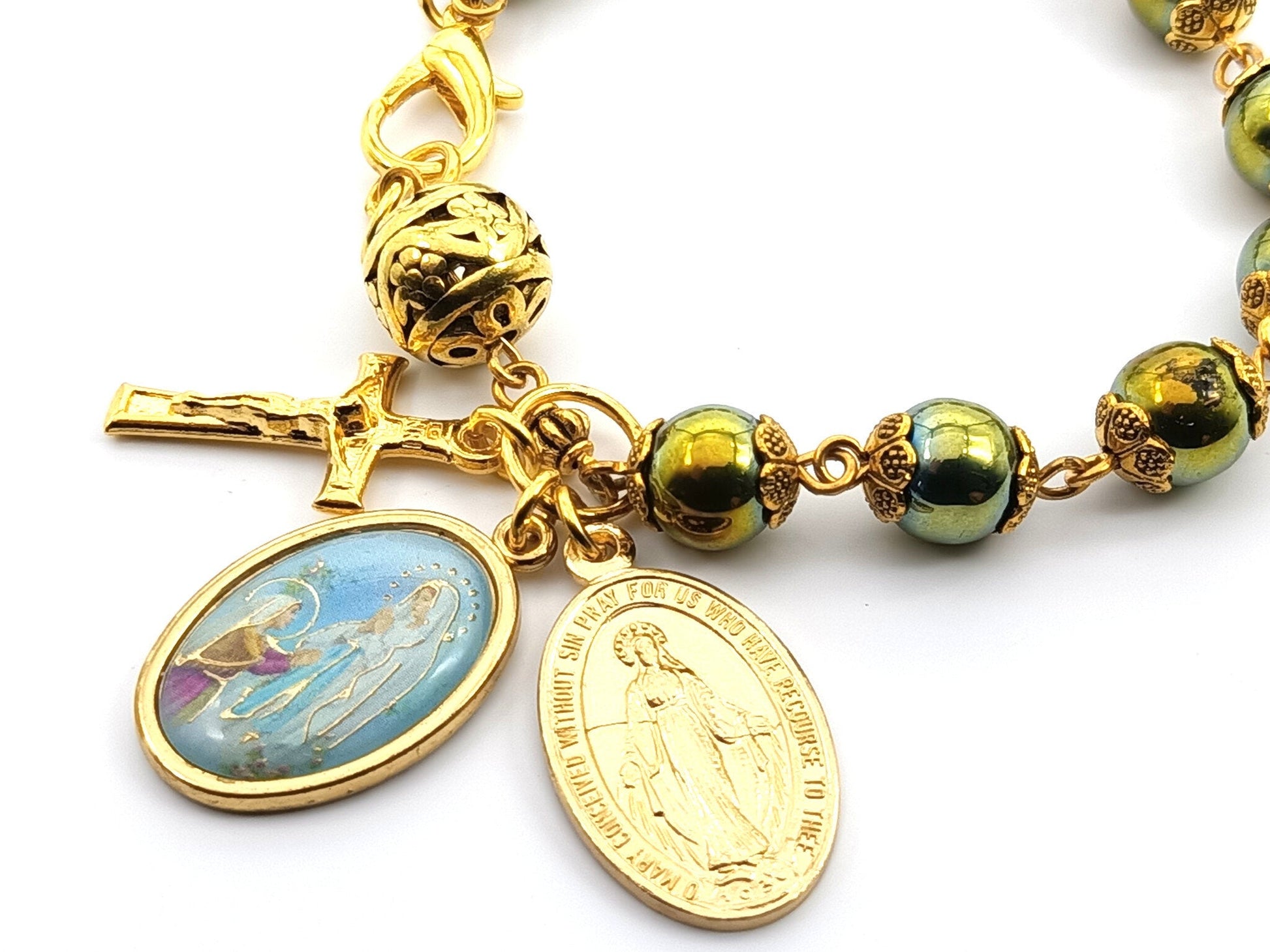 Our Lady of Lourdes unique rosary beads single decade bracelet with green hematite and gold beads, crucifix, picture medal and miraculous medal.