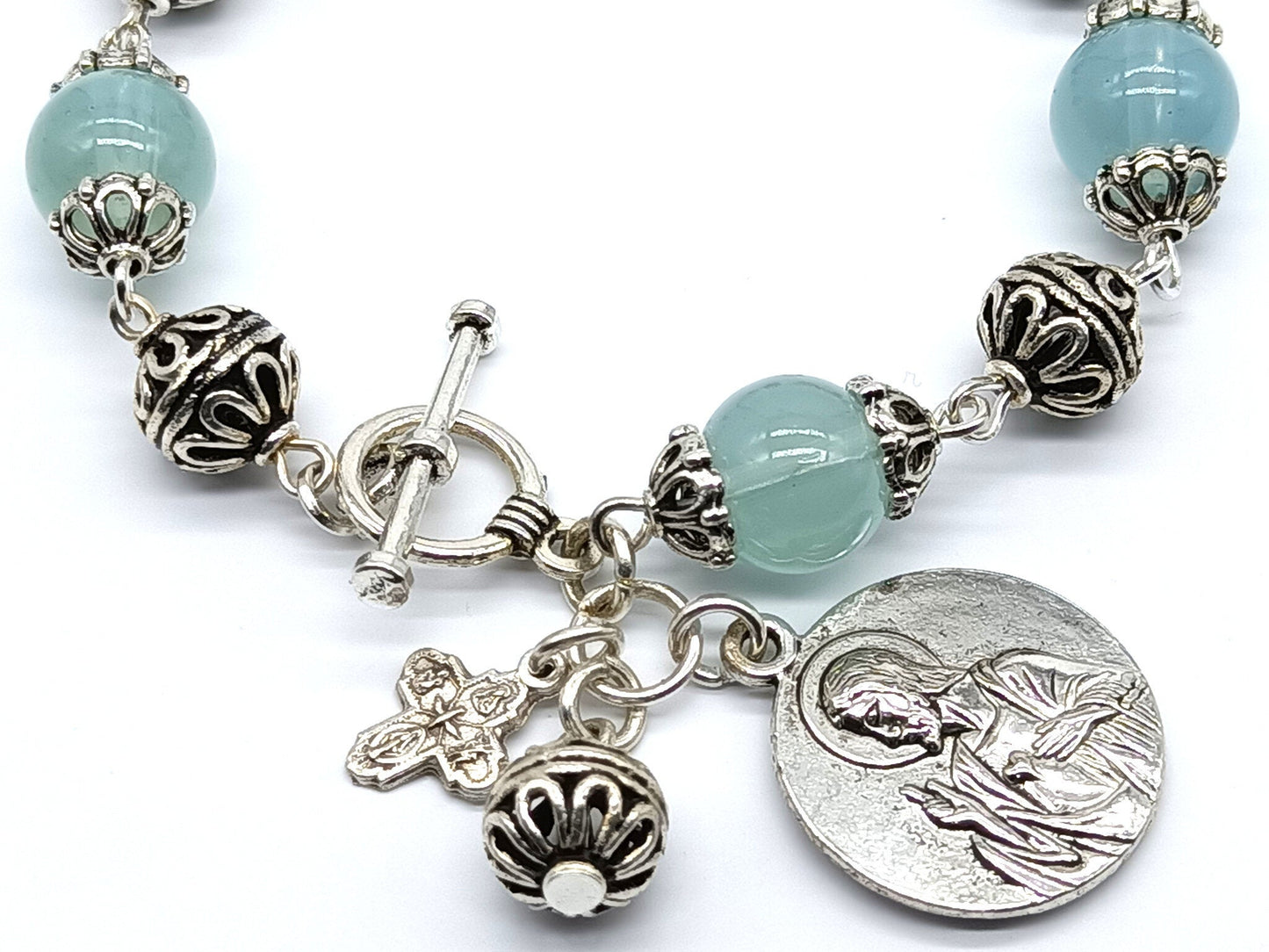 Our Lady of Mount Carmel unique rosary beads single decade bracelet with pale blue glass beads, silver cross, medals and beads.