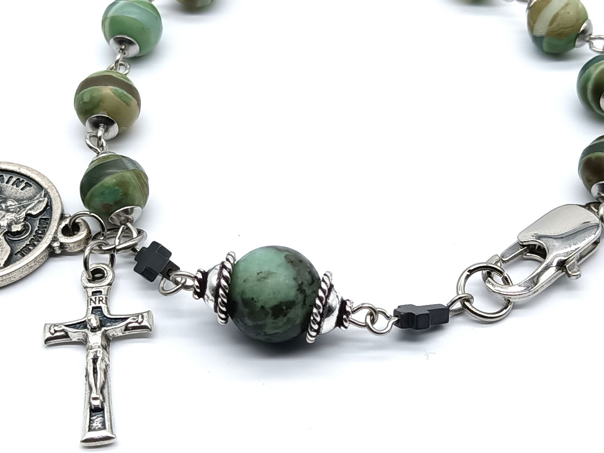 Saint Michael unique rosary beads single decade bracelet with green gemstone beads, silver crucifix, St. Michael medal and lobster clasp.