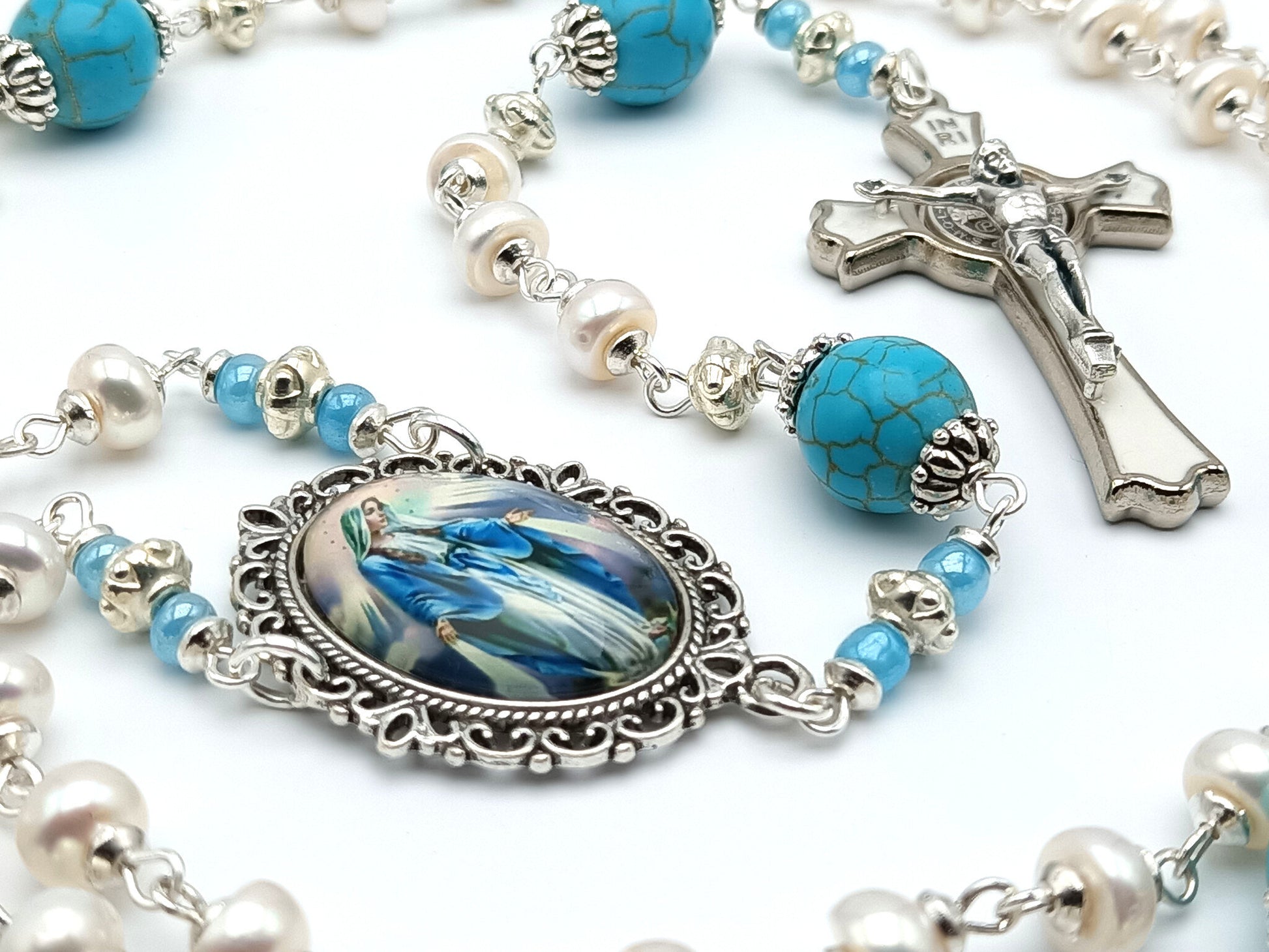 Our Lady of Grace unique rosary beads with genuine pearl beads, silver and white enamel Saint Benedict crucifix, blue gemstone pater beads and picture centre medal.