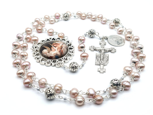 Guardian angel unique rosary beads with fresh water pearl beads, silver pater beads, angel crucifix and picture centre medal.