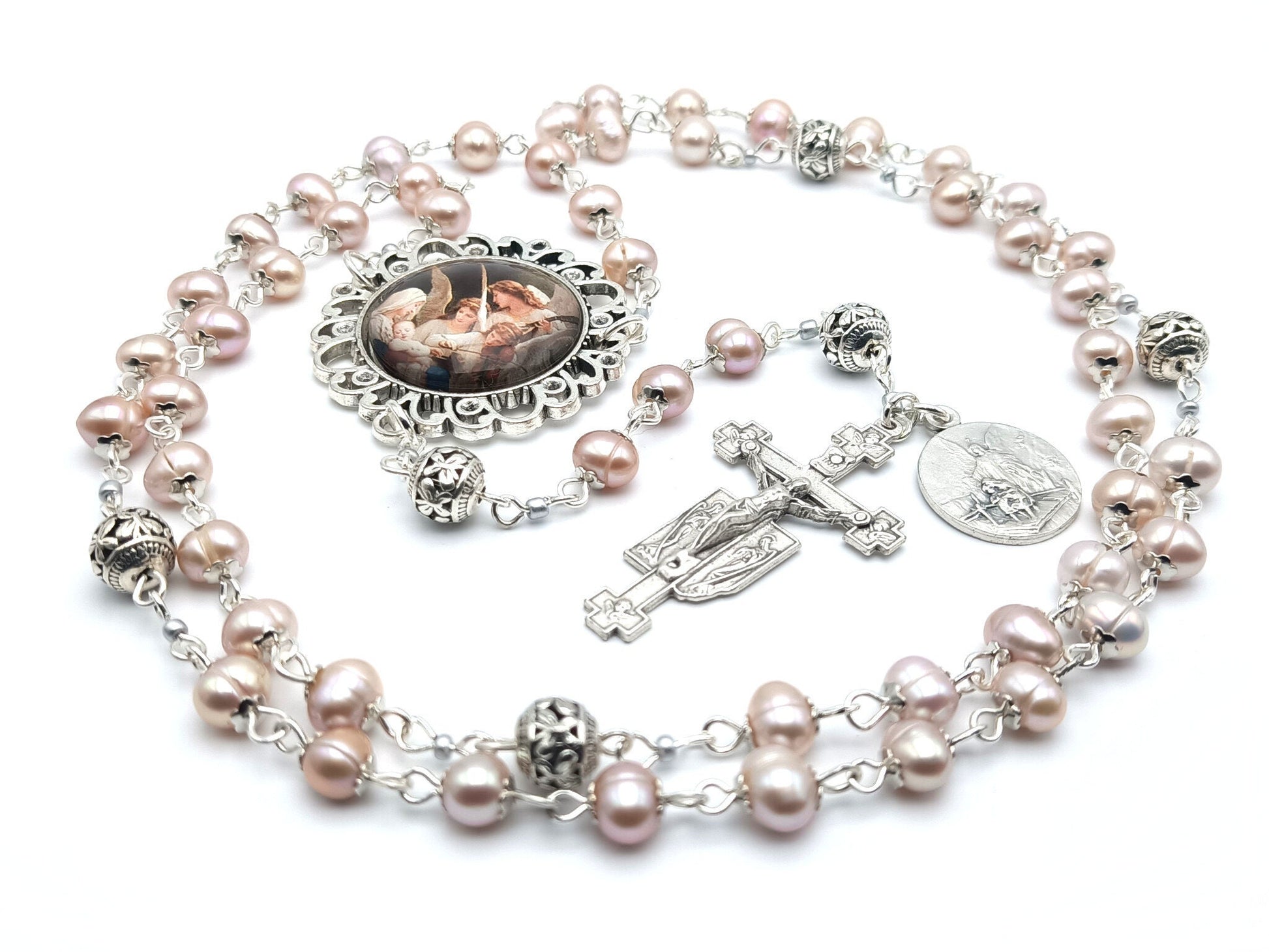 Guardian angel unique rosary beads with fresh water pearl beads, silver pater beads, angel crucifix and picture centre medal.