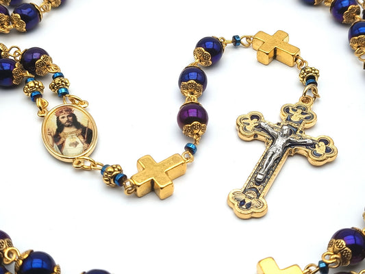 Christ the King unique rosary beads with blue hematite beads, golden cross pater beads, blue and gold crucifix and picture centre medal.