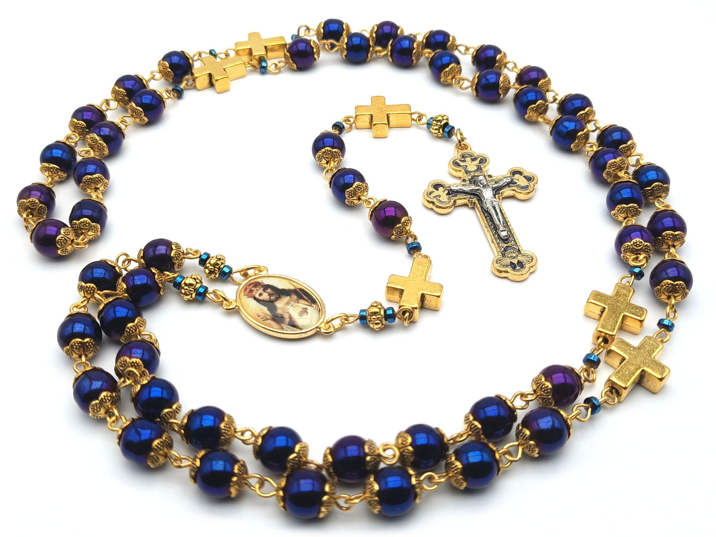 Christ the King unique rosary beads with blue hematite beads, golden cross pater beads, blue and gold crucifix and picture centre medal.