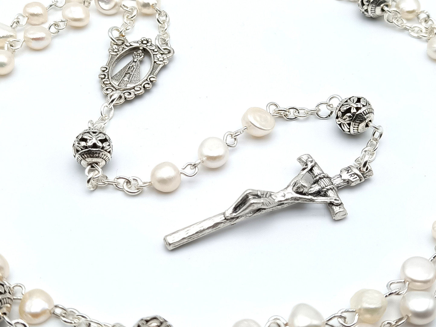 Our Lady of Loretto unique rosary beads with fresh water pearl beads, silver crucifix, pater beads and centre medal.