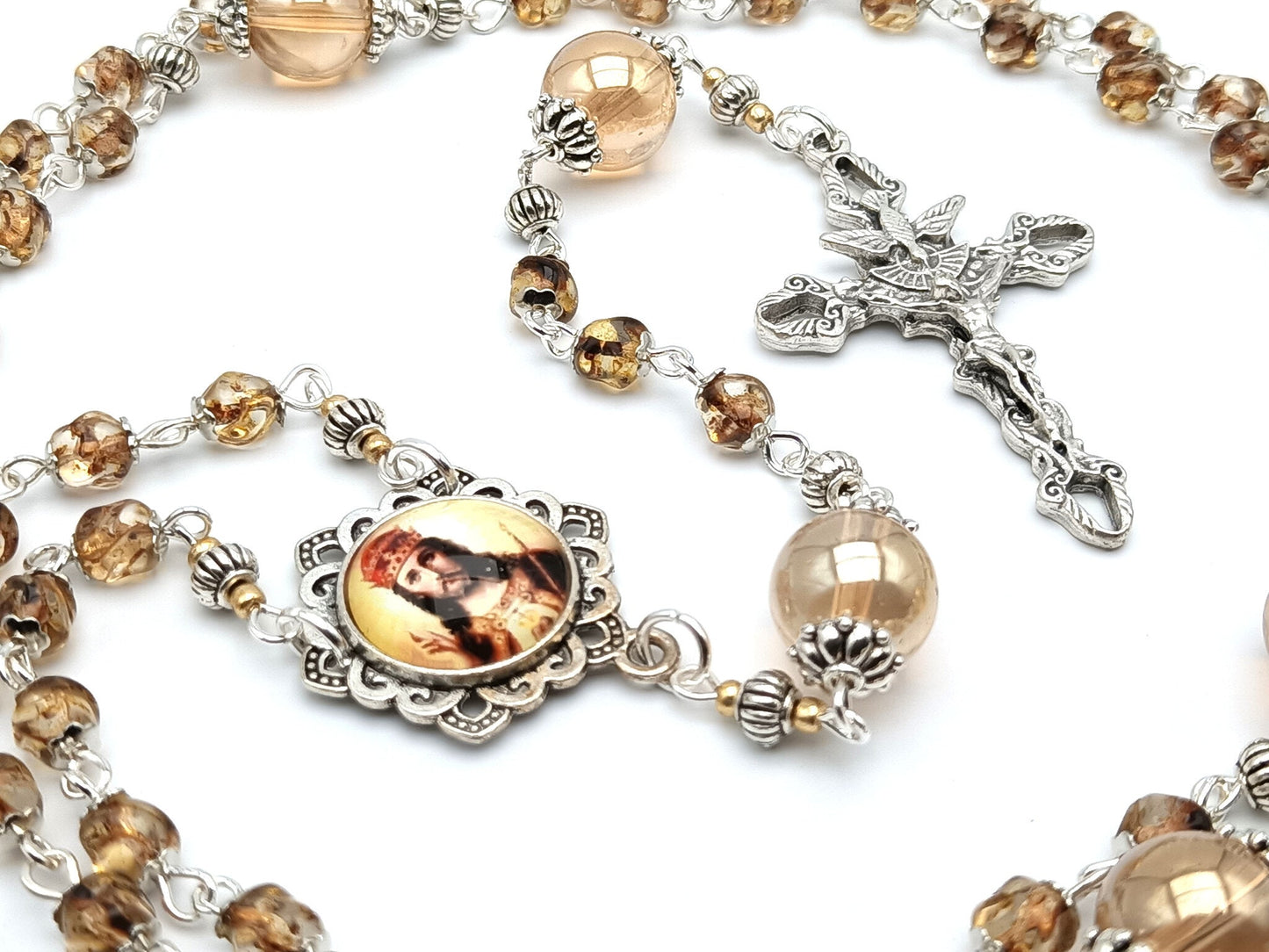 Christ the King unique rosary beads with nugget amber glass beads, silver Holy Spirit crucifix and picture centre medal.