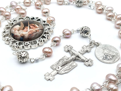 Guardian angel unique rosary beads with fresh water pearl beads, silver pater beads, angel crucifix and picture centre medal.