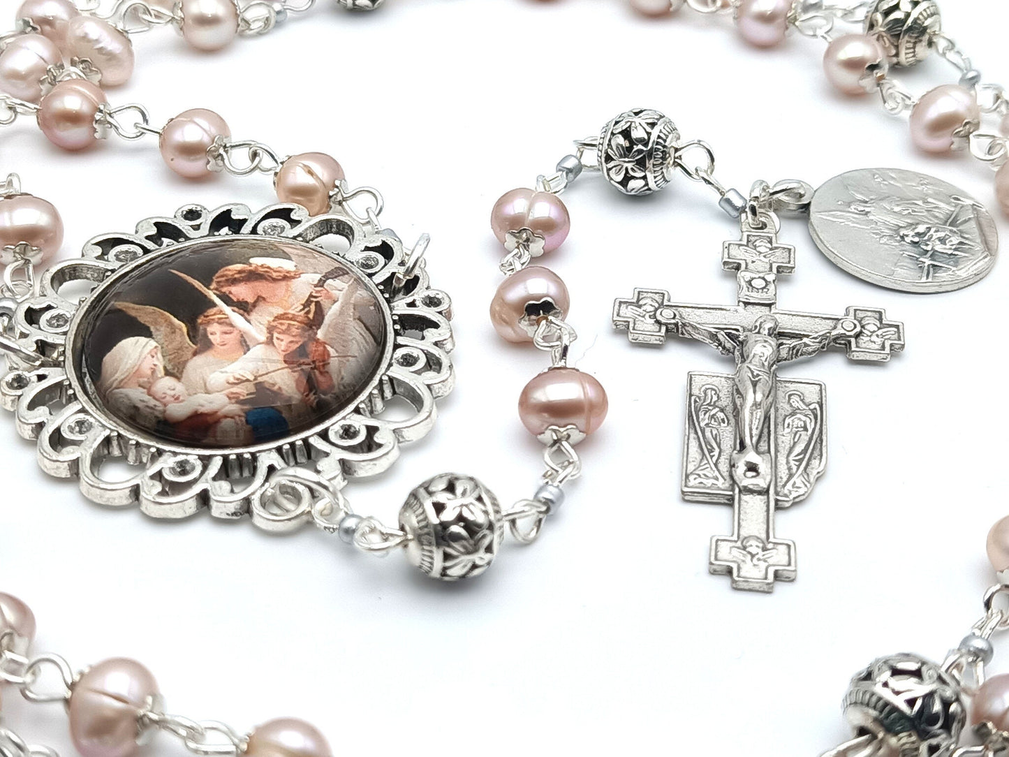 Guardian angel unique rosary beads with fresh water pearl beads, silver pater beads, angel crucifix and picture centre medal.