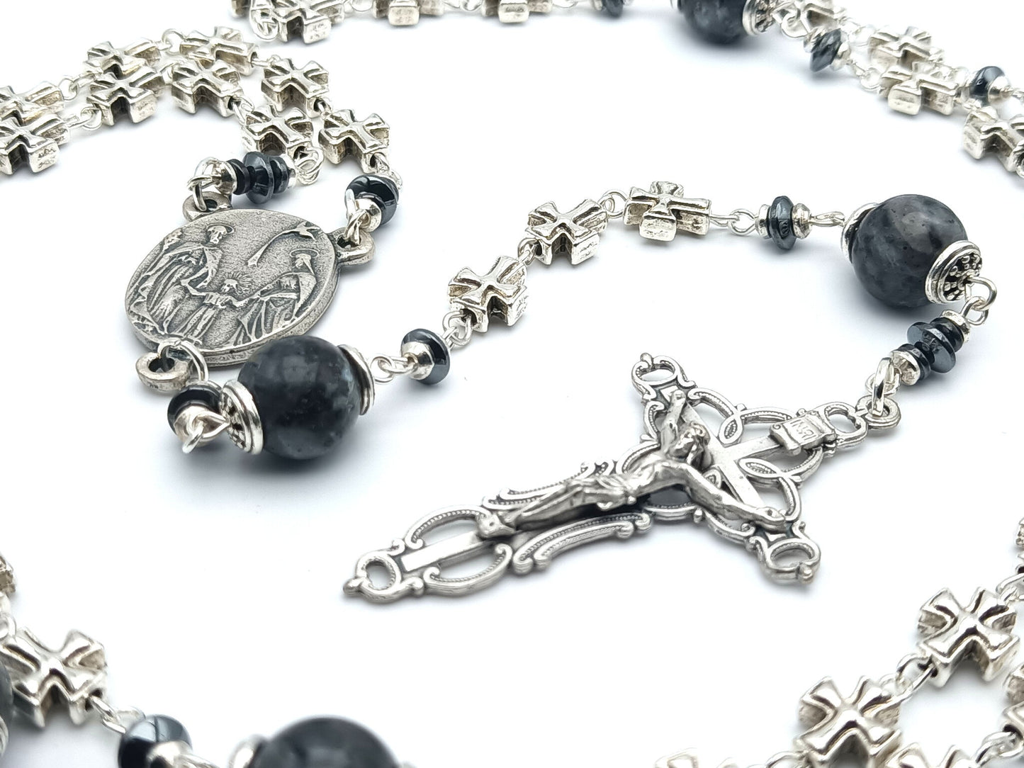 Three hearts of Jesus, Mary and Joseph unique rosary beads with metal cross beads, dark grey gemstone pater beads, silver bead caps, crucifix and centre medal.