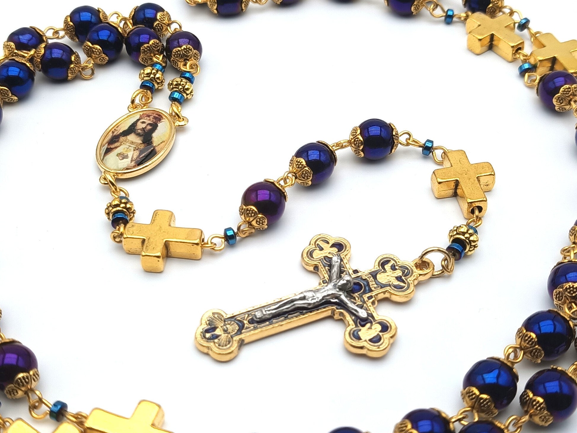Christ the King unique rosary beads with blue hematite beads, golden cross pater beads, blue and gold crucifix and picture centre medal.