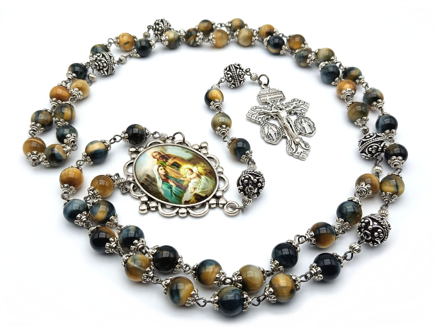 The Holy family unique rosary beads with tigers eye gemstone beads, silver pater beads, pardon crucifix and picture centre medal.