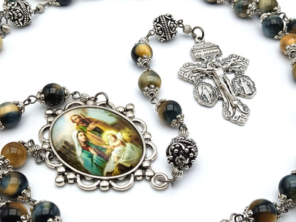 The Holy family unique rosary beads with tigers eye gemstone beads, silver pater beads, pardon crucifix and picture centre medal.