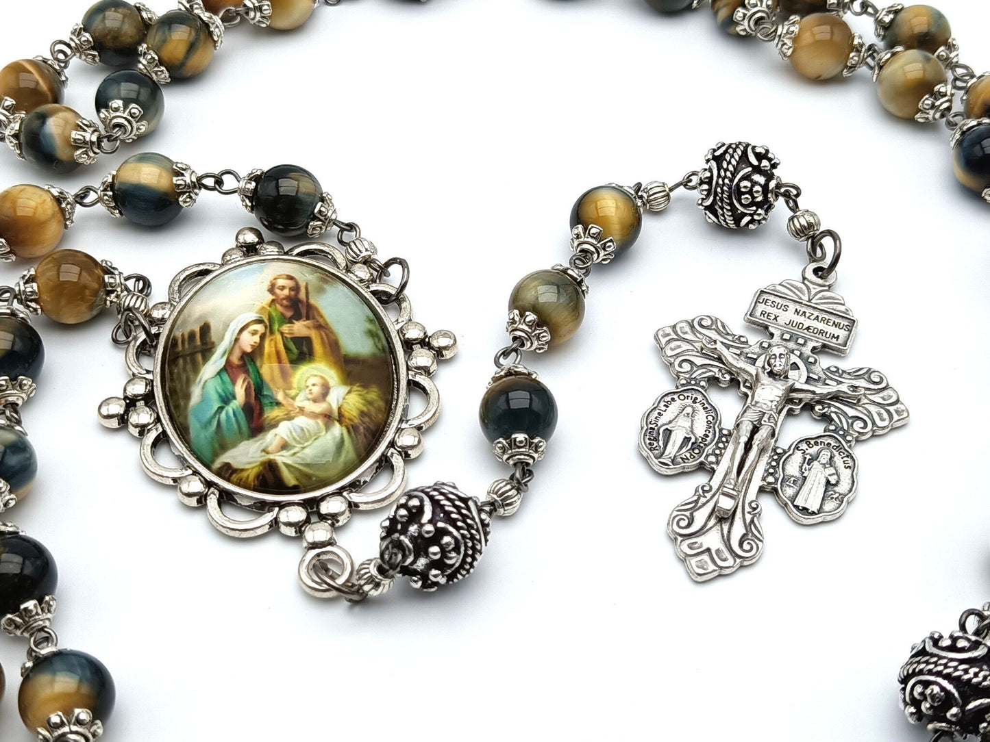 The Holy family unique rosary beads with tigers eye gemstone beads, silver pater beads, pardon crucifix and picture centre medal.