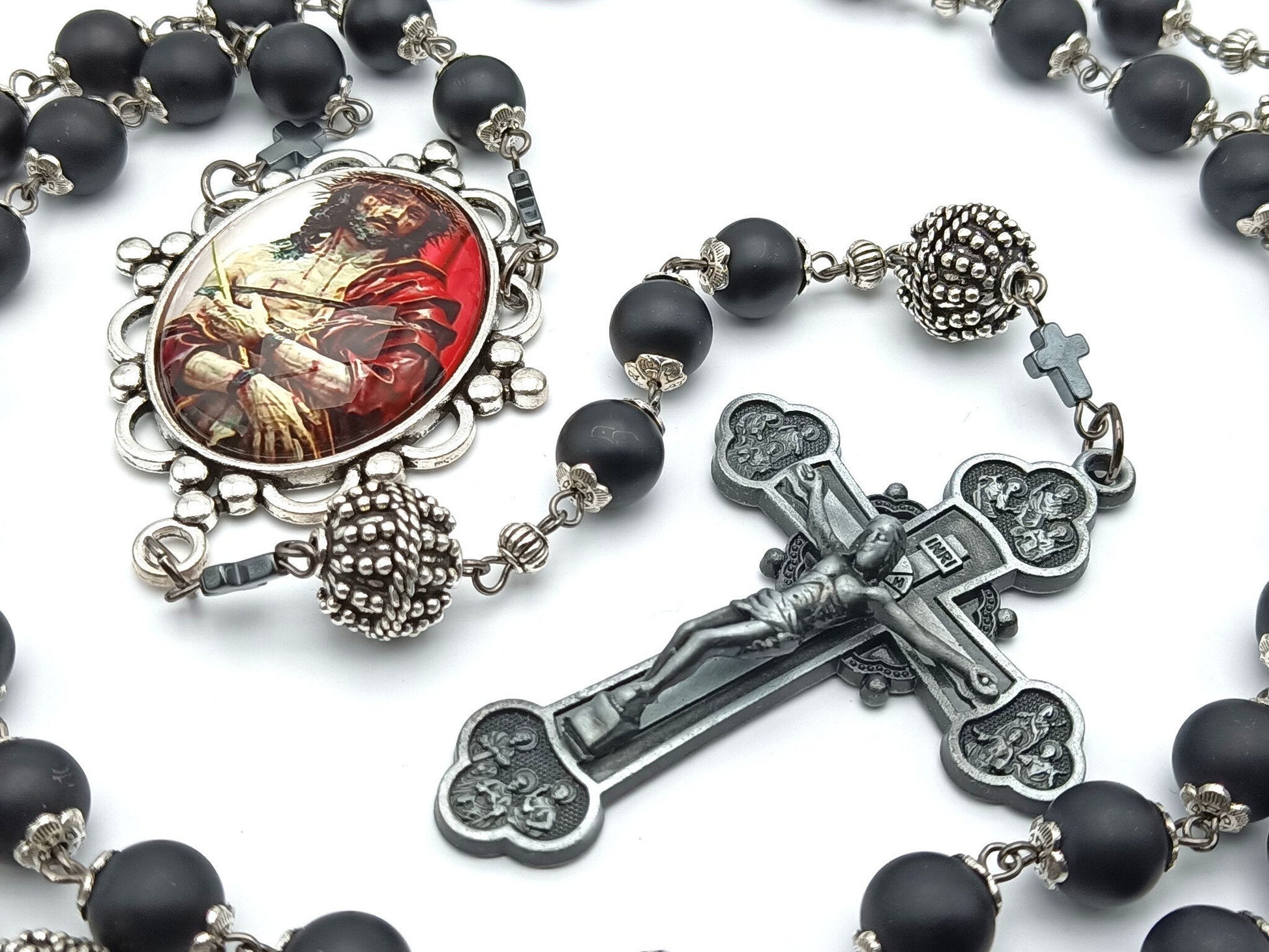 The Crucifixion unique rosary beads with onyx beads, silver pater beads, pewter twelve Apostles crucifix and picture centre medal.